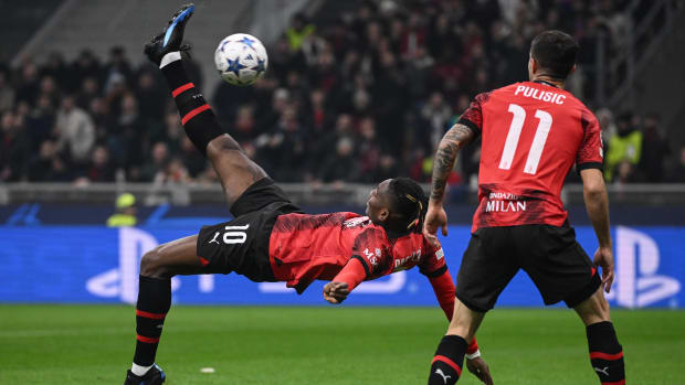 Rafael Leao pictured (left) scoring for AC Milan against PSG with an overhead kick in November 2023